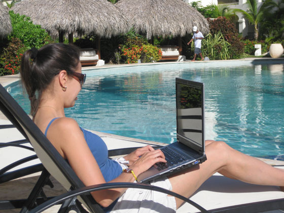Rosemary Working Our Business from the Pool in the Dominican Republic