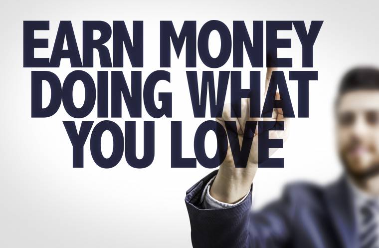 Business man pointing the text: Earn Money Doing What You Love